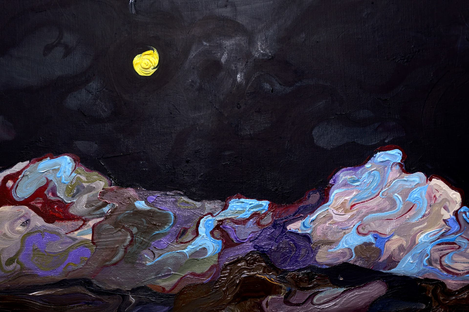 Eclipse Night — detail of the yellow moon above the ridge, set in a dark, near-black sky.